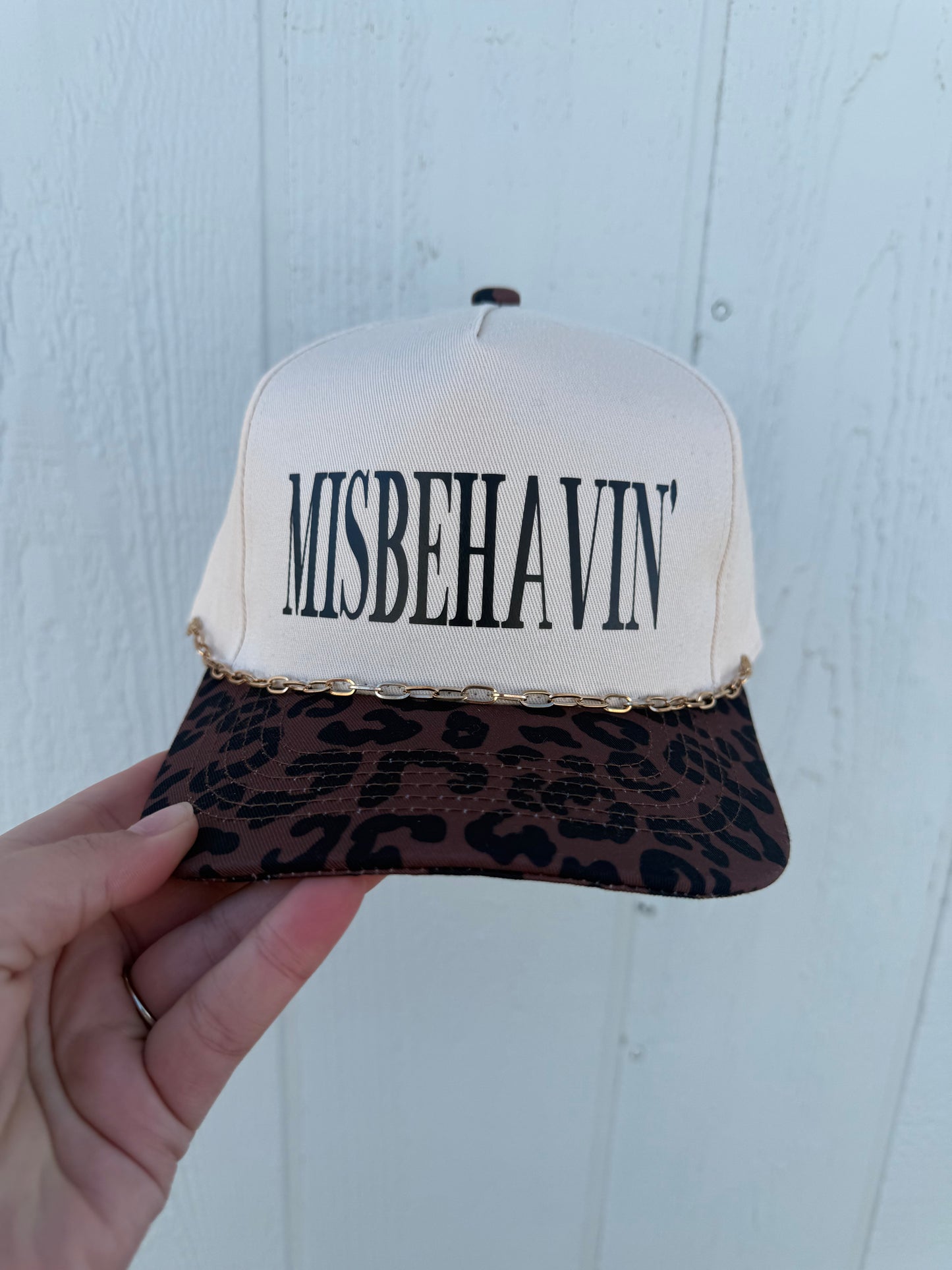 MISBEHAVIN’ trucker hat