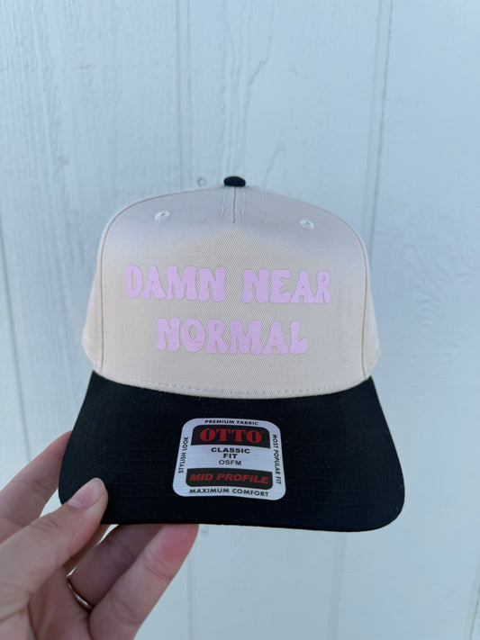 Damn Near Normal Trucker hat